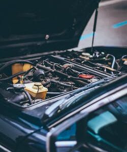 Detailed view of an exposed car engine under maintenance in Barcelona.